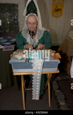 French lady in traditional dress lacemaking at Cider Fayre Caudebec en Caux on River Seine near Lillebonne France Stock Photo