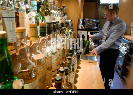 Barman in the Bar Using the Till Stock Photo