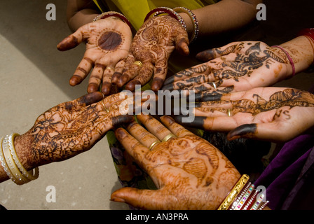 Close view of hands decorated with henna Stock Photo