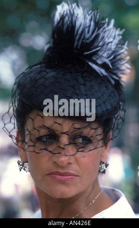 Woman 1980s fashion UK fashionable hat and veil  at Ladies Day Royal Ascot horse races racing Berkshire England 1985 HOMER SYKES Stock Photo