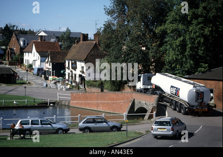 Finchingfield small pretty village with fuel tanker negotiating narrow hump back bridge Essex England UK Stock Photo