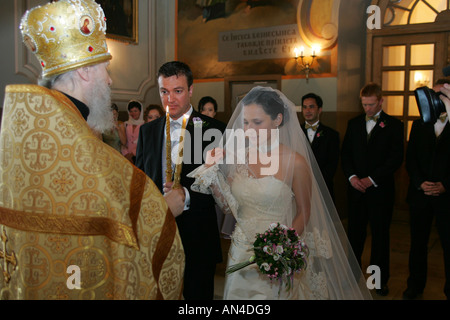 A bride and groom being married in a Russian Orthodox Church Stock Photo