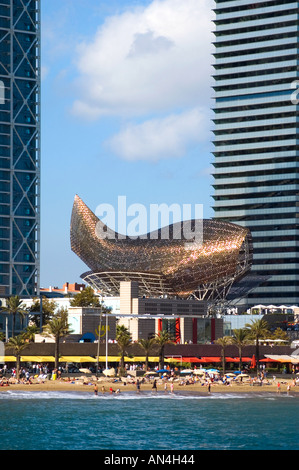 Architect Frank Gehrys Peix gold fish structure by between Torre Mapfre and Hotel Arts in Port Olimpic Barcelona Spain Stock Photo