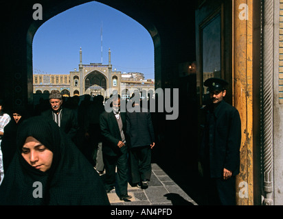Men and women exiting a mosque in Qom Stock Photo