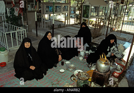 Muslim women at a small gathering at a cemetary in Tehran Iran Stock Photo