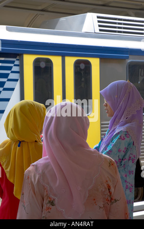 Colourful female Islamic commuters. Kuala Lumpur, Malaysia Stock Photo