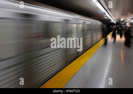 Subway train arriving to a platform Stock Photo