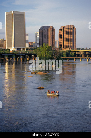 USA VIRGINIA RICHMOND White water rafters on the James River with the skyline of Richmond Virginia in the background Stock Photo