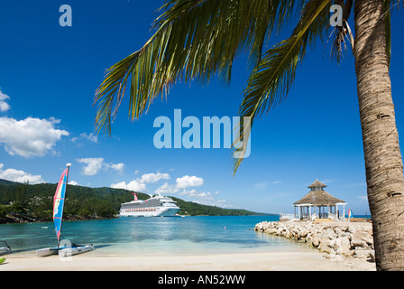 Cruise ship Carnival Valor in Ocho Rios Bay from the beach outside 'Sunset Jamaica Grande' Hotel, Ocho Rios, Jamaica Caribbean Stock Photo