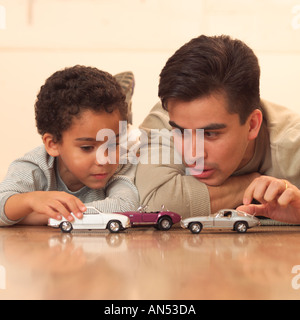 Father and son playing together Stock Photo