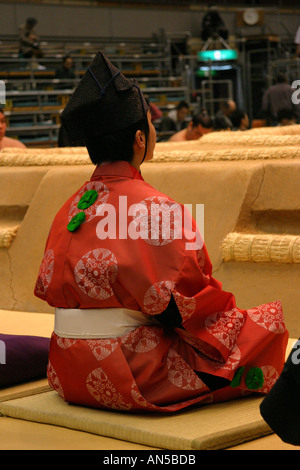 Sumo wrestling referee watches a sumo wrestling fight in Osaka Japan Asia Stock Photo