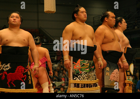 Sumo wrestlers parade in colourful ceremonial clothing during the opening pre match ceremony Osaka Kansai Japan Asia Stock Photo