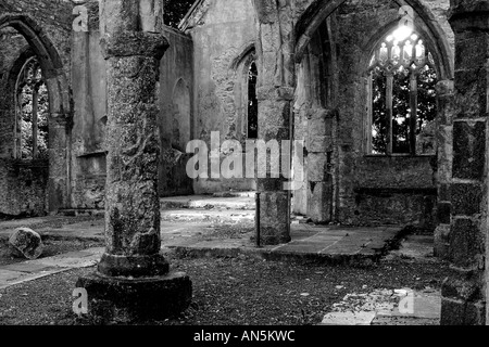 Monochrome interior of a burnt out church attacked by arsonists and left as a ruinous shell Stock Photo