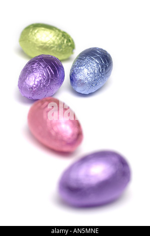 Foil covered easter eggs on white background Stock Photo