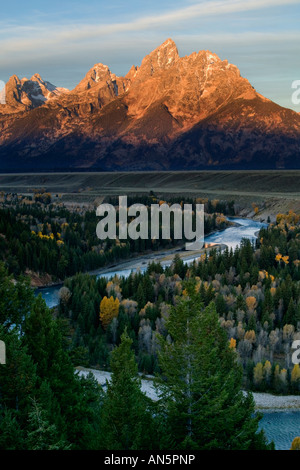 Grand Teton sunrise reflected in Snake river Stock Photo