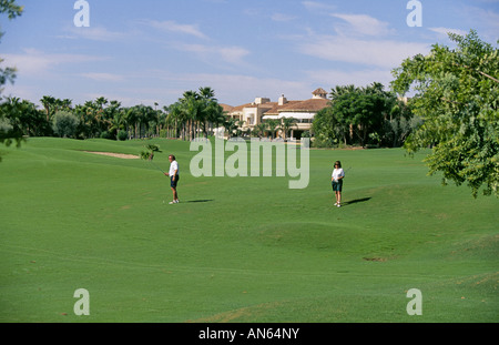 Golfers play a hole at an upscale resort and hotel in Scottsdale Arizona Stock Photo