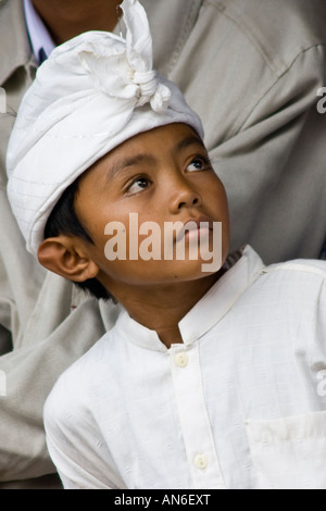 Young Boy during Odalan Ceremony at Pura Basukian or Besakih Puseh Jagat Hindu Temple Bali Indonesia Stock Photo