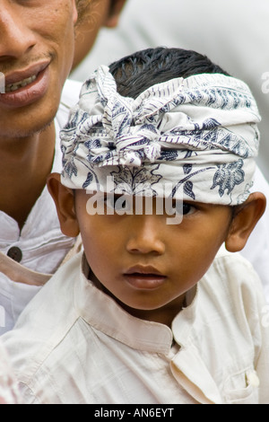 Young Boy during Odalan Ceremony at Pura Basukian or Besakih Puseh Jagat Hindu Temple Bali Indonesia Stock Photo