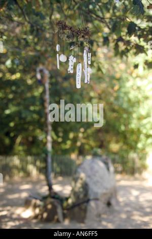 Hanged paper wishes at Merlin's tomb, Broceliande enchanted forest, Paimpont, Ille et Vilaine, Brittany, France, Europe Stock Photo