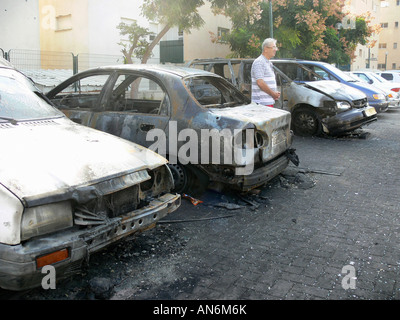Israel Sderot house damaged by a Qassam rockets launched by Hamas from Gaza damaged cars November 11th 2007 Stock Photo