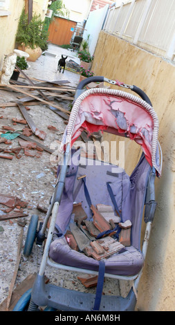 Israel Sderot house damaged by a Qassam rockets launched by Hamas from Gaza damaged children pram December 14th 2007 Stock Photo