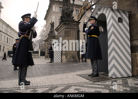 Castle guards stand firm during changing of guards process at the main entrance to Prague Castle in Czech republic
