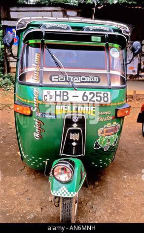 Small three wheeled taxi in Pussellawa Sri Lanka waiting for hire Stock Photo