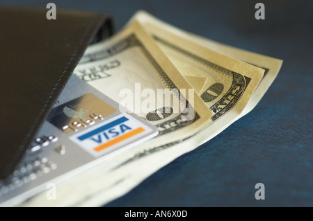 credit card and US dollar notes coming out of a wallet Stock Photo