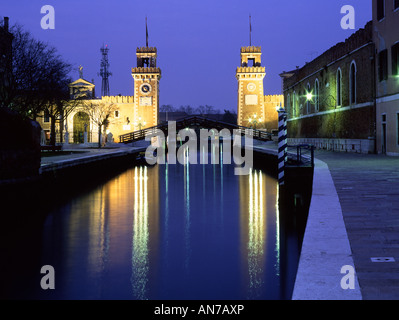 Arsenale gateway reflected in canal at night Castello Venice Veneto Italy Stock Photo