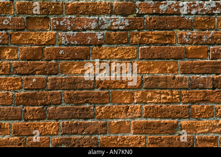 Ancient red weathered brick wall detail Stock Photo