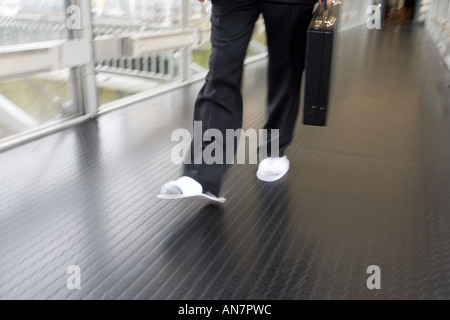 business man in slippers Stock Photo