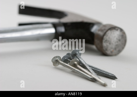 Five nails and hammer Stock Photo