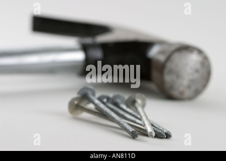 Five nails and hammer Stock Photo