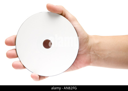 Female hand holding a blank disc. Isolated on a white background. Stock Photo
