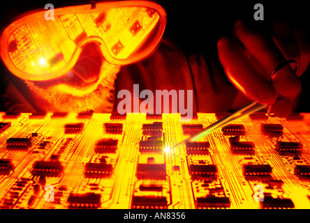 man working on circuit board Stock Photo