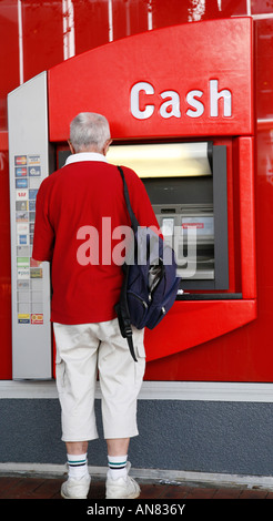 Man using ATM Stock Photo