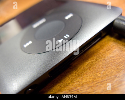 close up image of ipod on a wooden table top Stock Photo