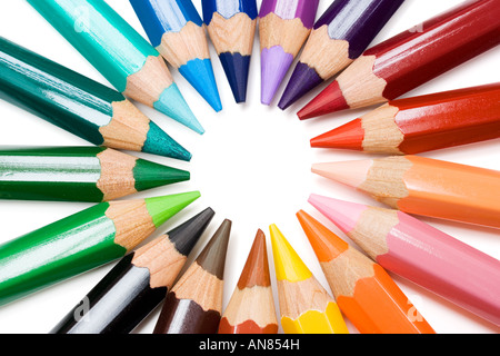 Colored pencils forming a color circle. White background. Stock Photo