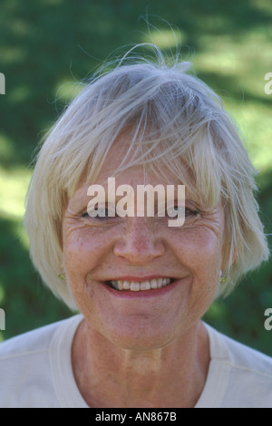 Portrait 57 year old Caucasian woman smiling Stock Photo