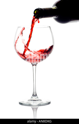 Red wine pouring down from a wine bottle Stock Photo