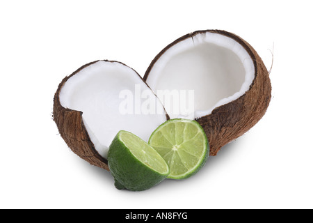 Coconut and Lime halves cut out on white background Stock Photo