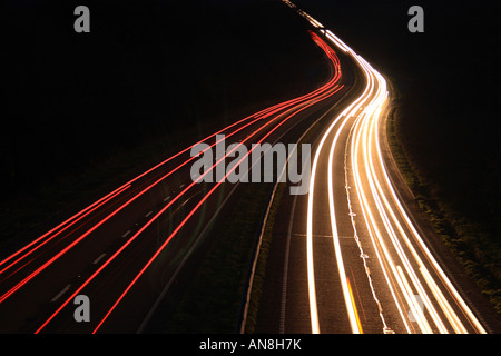 Light trails on the A30 from Devon into Cornwall at dusk in Devon England Stock Photo