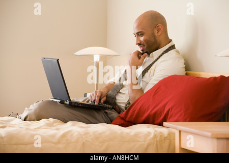 African businessman typing on laptop Stock Photo