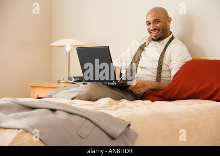 African businessman typing on laptop Stock Photo