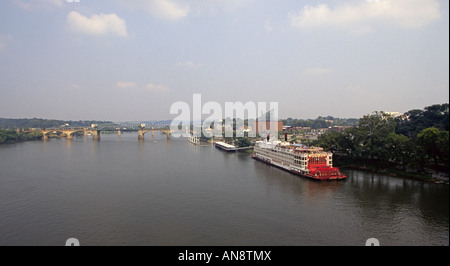 The paddlewheel steamboat Mississippi Queen docks near the famous Tennessee Aquarium on the Tennessee River Stock Photo
