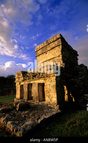 Sunset at Tulum Mayan ruins on cliff overlooking ocean, Cancun, Mexico Stock Photo