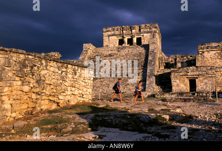 Sunset at Tulum Mayan ruins on cliff overlooking ocean, Cancun, Mexico Stock Photo