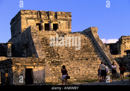 Sunset at Tulum Mayan ruins on cliff overlooking ocean, Cancun, Mexico Stock Photo