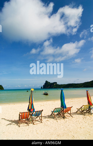 beach chairs on deserted island of Koh Phi Phi in Thailand Stock Photo