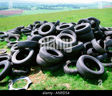 Tyres dumped in countryside Stock Photo